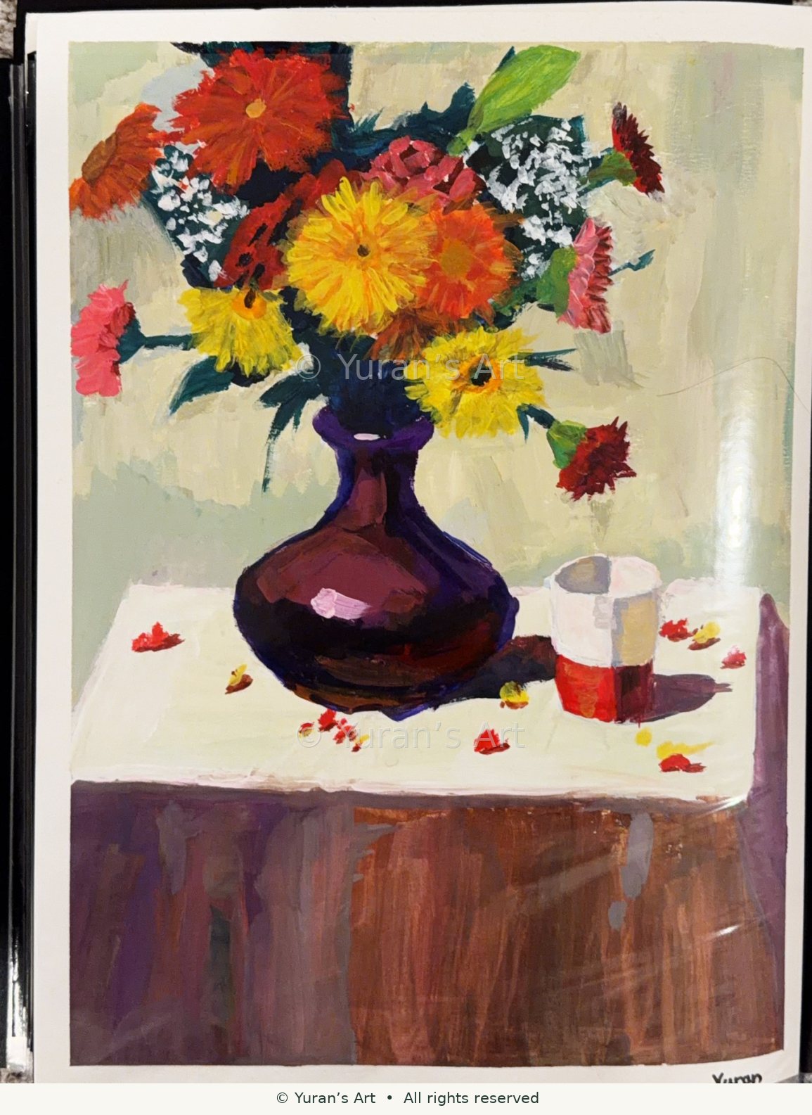 A vase of colorful flowers beside teacups.