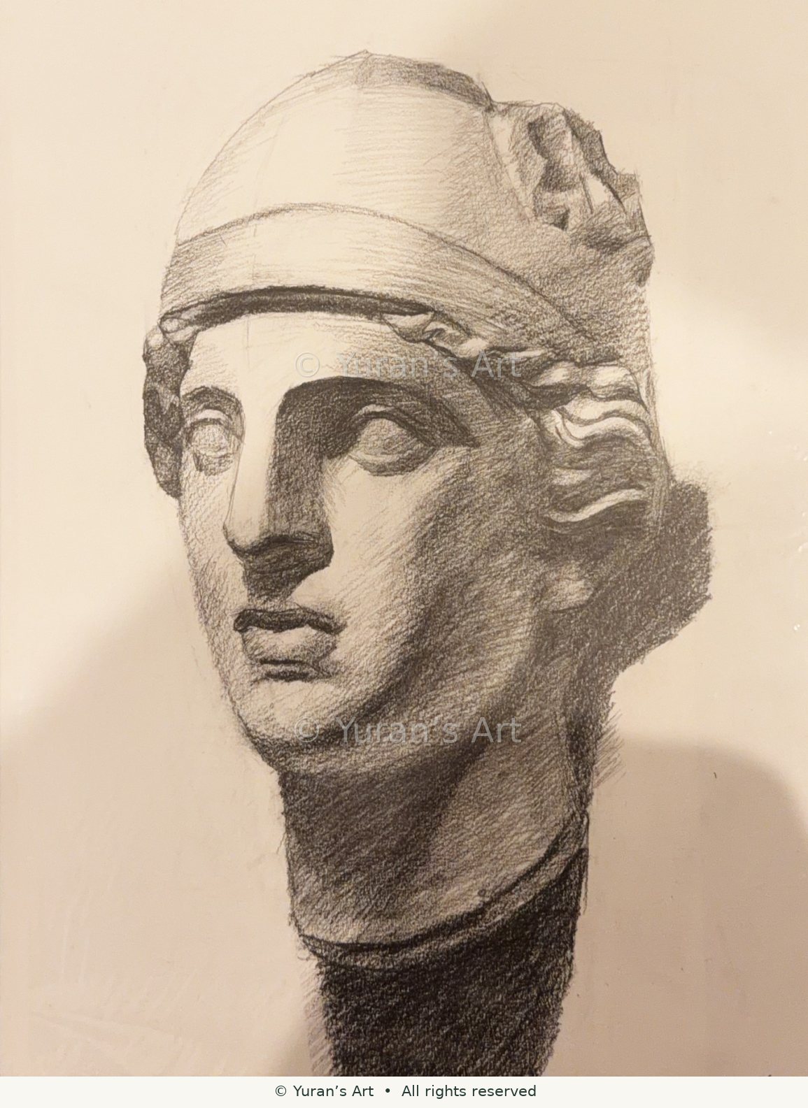 A shaded drawing of a classical sculpted head.